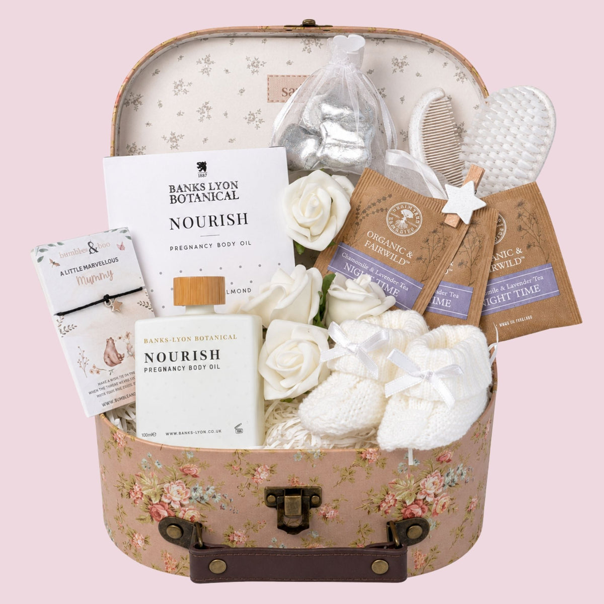 Luxury mum to be gifts hamper with pregnancy presents including body oil, treats and baby essentials