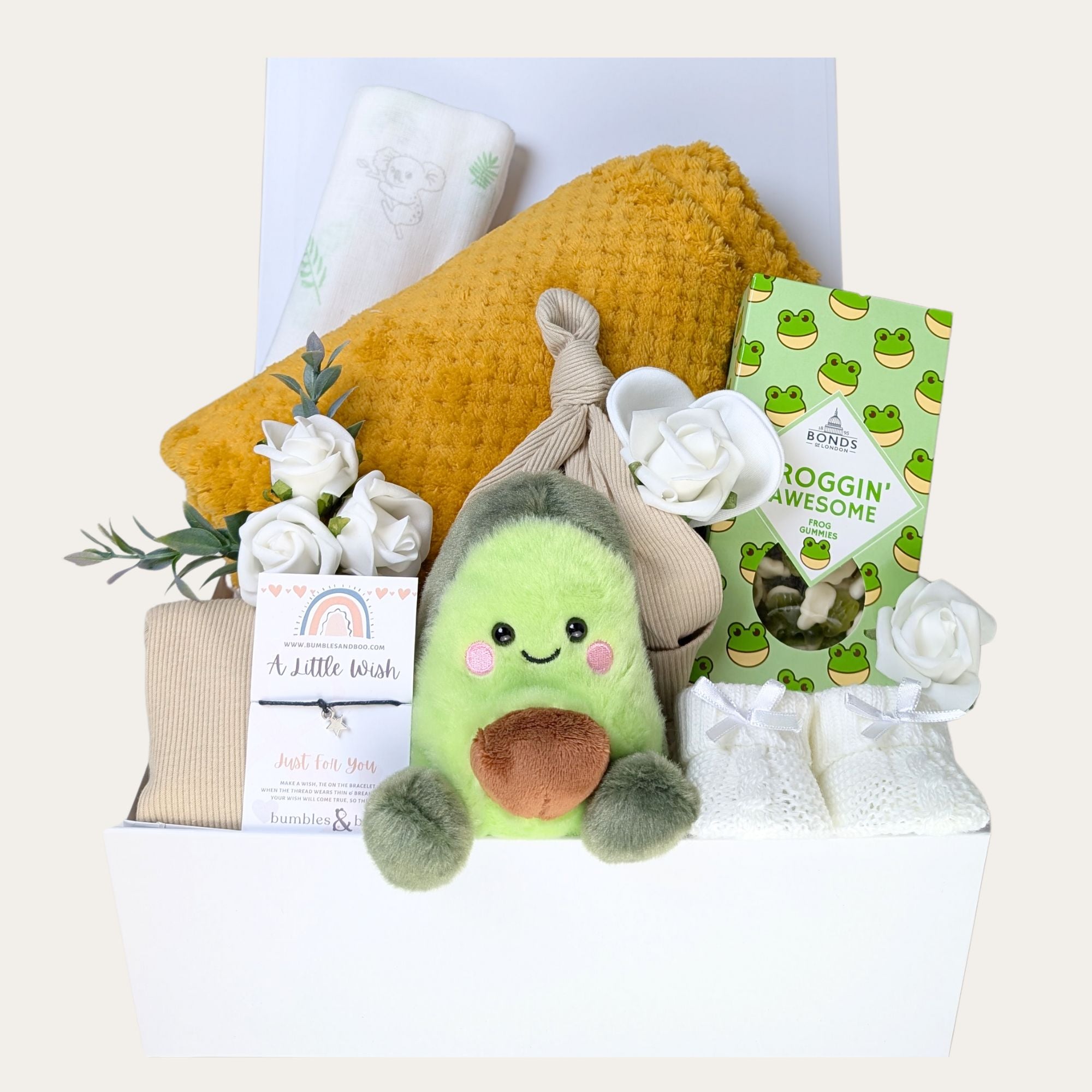 pregnancy gift hamper with mustard yellow baby blanket, muslin, bib, hat, sweets, booties and avocado soft toy. Bumbles and Boo.