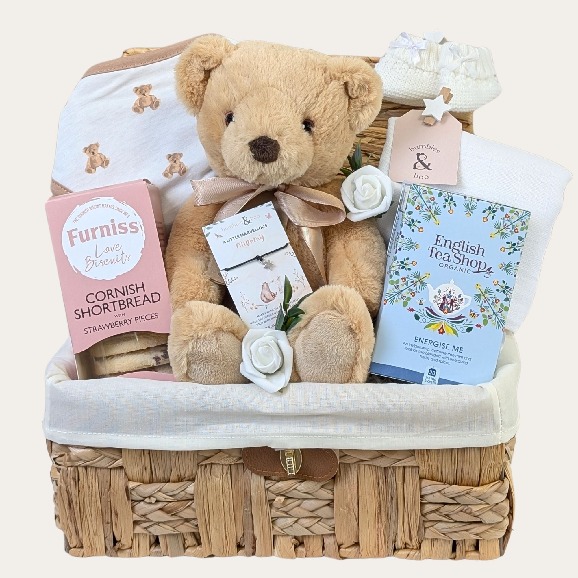Mum to be hamper basket packed with pregnancy gifts for an expectant mum including snacks, bracelet and baby essentials
