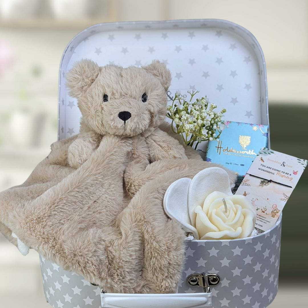 mum to be gifts trunk with bear comforter blanket.