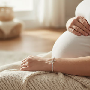 Mummy & Bump silver Bracelet presented on its Joma Jewellery card
