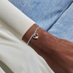 Mummy & Bump silver Bracelet worn on the wrist