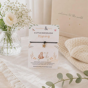 Mummy wish bracelet with a star charm and black cord displayed on a Marvellous Mummy card