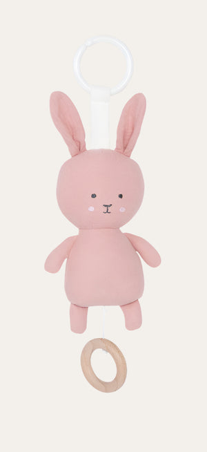 musical pink bunny that plays a lullaby when the string is pulled