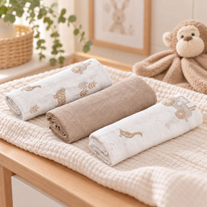 white and beige baby muslin squares