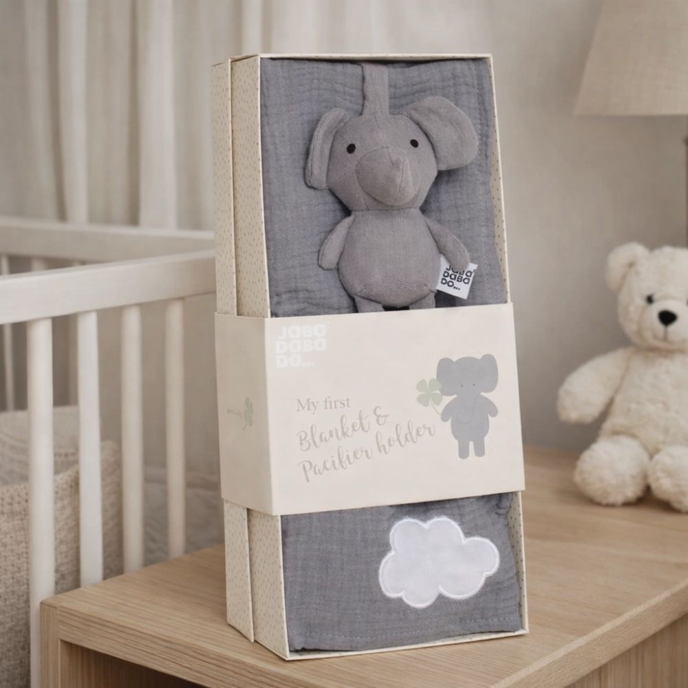 Gray elephant plush toy and blanket set in a gift