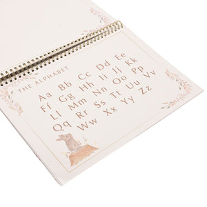 Alphabet activity page in the spiral-bound busy book, showing upper and lower case letters.