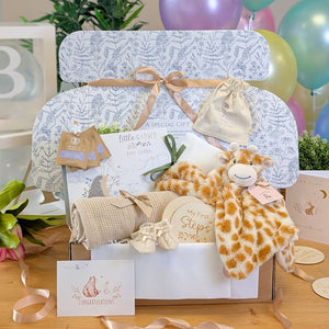New baby gifts hamper with giraffe comforter and milestone discs packed beautifully in a gift box