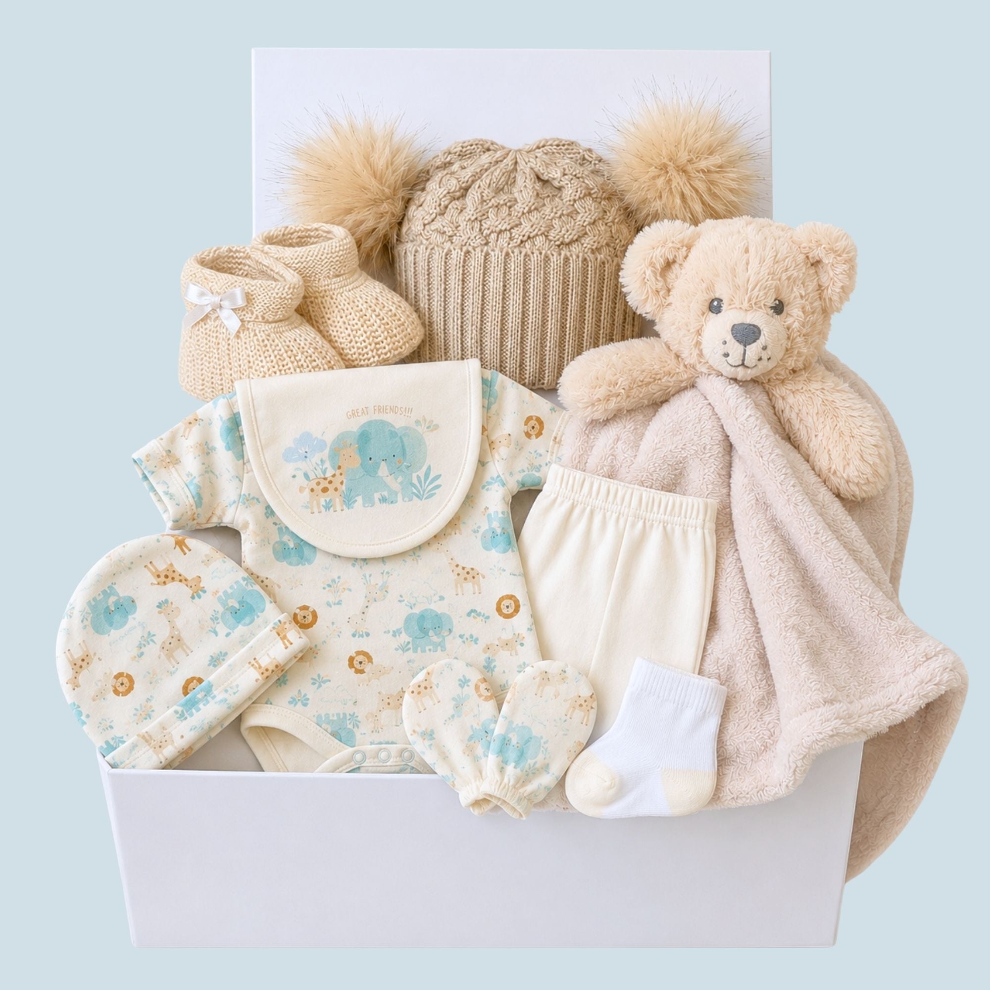 Baby gift hamper with presents including teddy bear, booties and white jungle clothing packed in a gift box