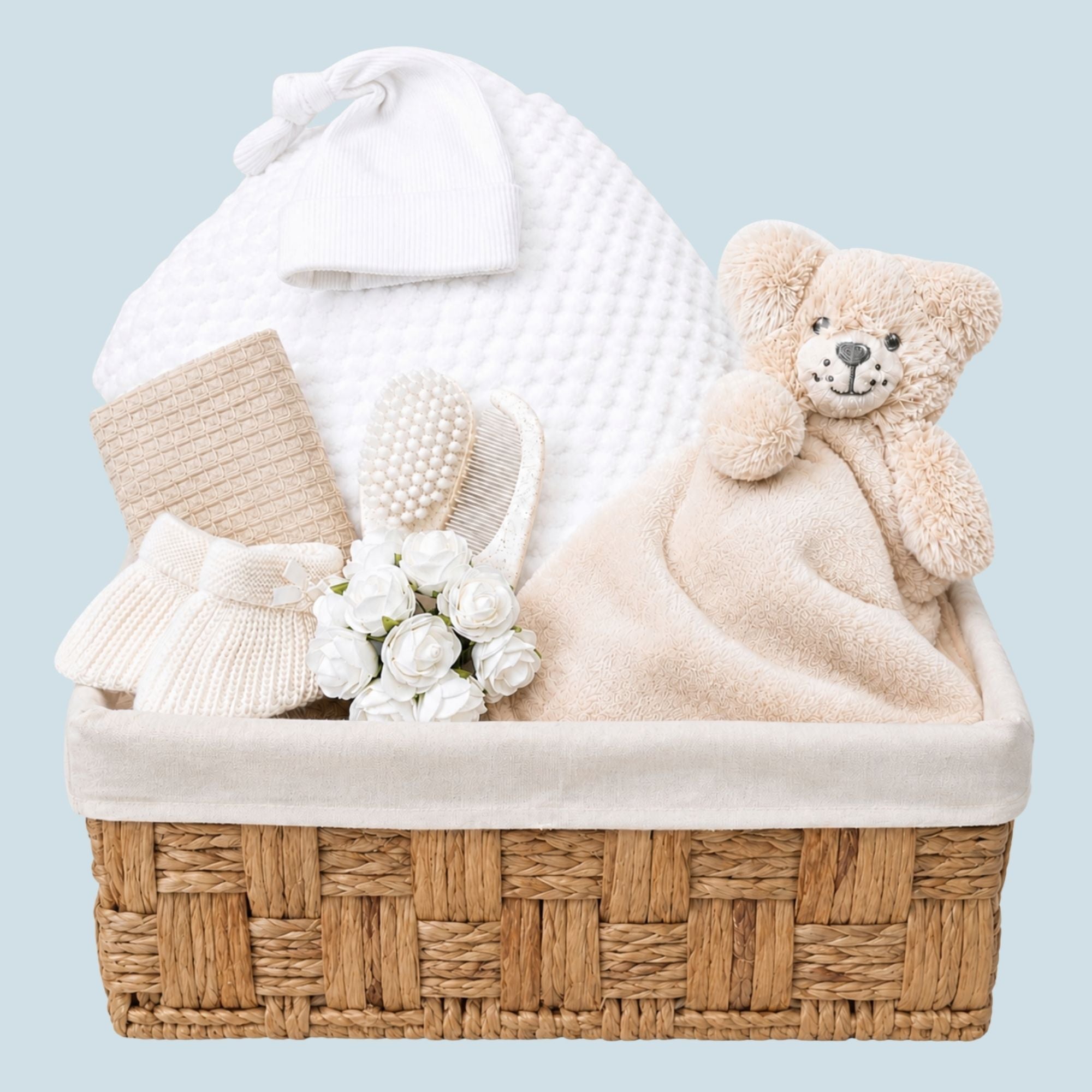 Newborn Baby Gifts Hamper Basket with blanket and white clothes. Hamper by Bumbles and Boo.