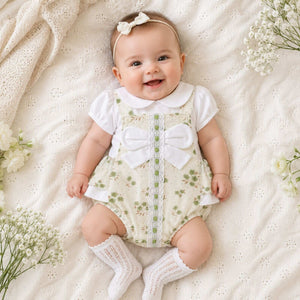 Floral baby girl Spanish romper in white and sage green with lace trim and bow, traditional style baby clothes outfit.