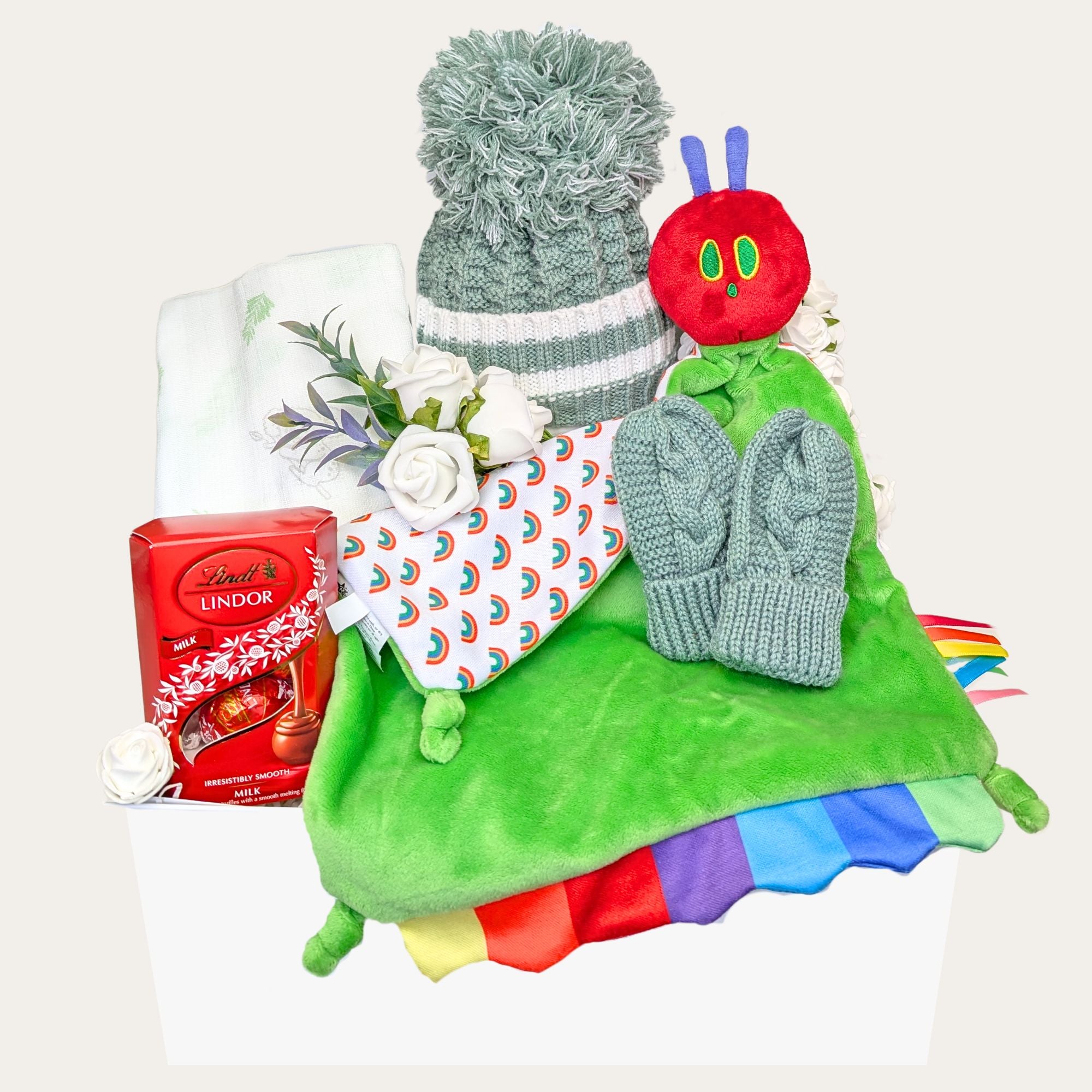 New mum and baby hamper with hungry caterpillar theme. Gifts include chocolate and baby products by Bumbles and Boo.
