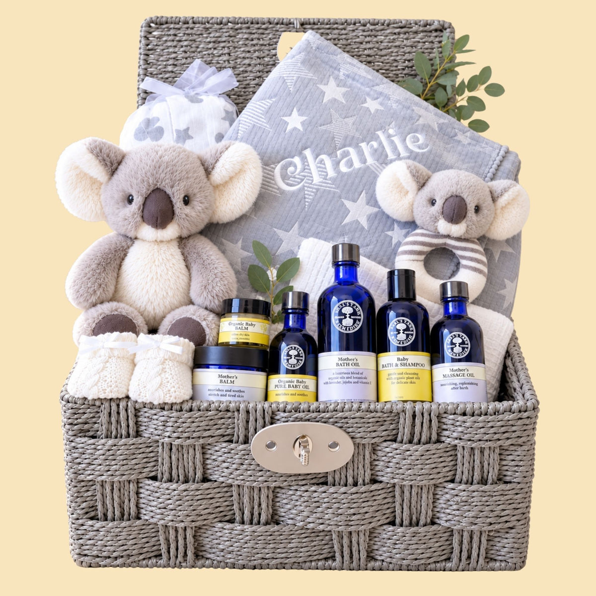New mum gifts hamper basket with a grey personalised baby blanket and organic skincare. Bumbles and Boo.