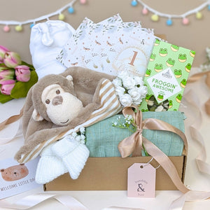 New mum gifts box in green and brown. This gift hamper contains a monkey comforter and sweets for mummy. Bumbles and Boo.
