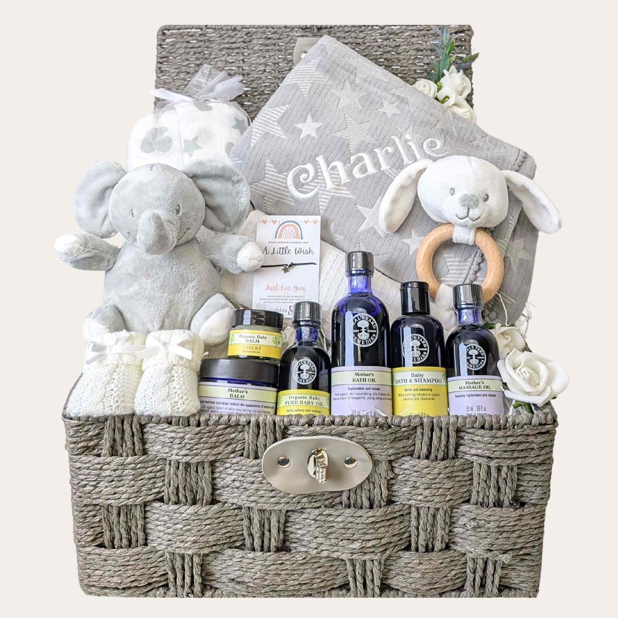 New mum gifts hamper basket with a grey personalised baby blanket and organic skincare. Bumbles and Boo.