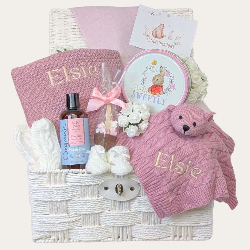 Adorable pink and white themed gift hamper for a new mum to celebrate her new arrival. Presents for baby and sweet treats for mum. Bumbles and Boo.