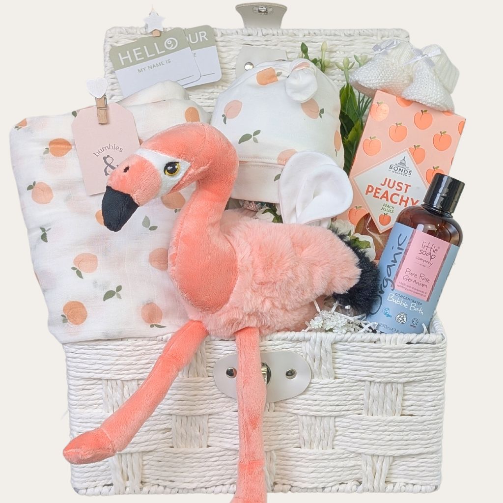 Peach themed New Mum Gifts hamper filled with presents for Mum and baby in a white keepsake hamper basket. Bumbles and Boo.