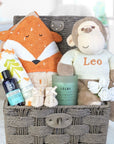 new mum and baby hamper with fox and monkey theme and treats for mum too.