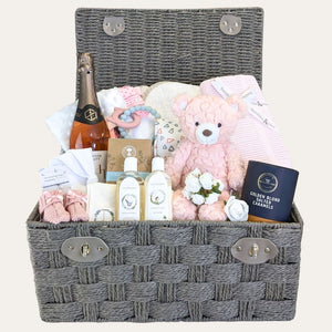 New mum hamper gifts basket with presents including food, drink, skincare and baby items in a hamper by Bumbles and Boo.