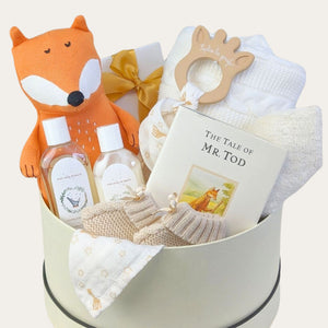 New mum and baby hamper gifts with knit blanket, chocolates, fox soft toy, baby wash and story book. Bumbles and boo