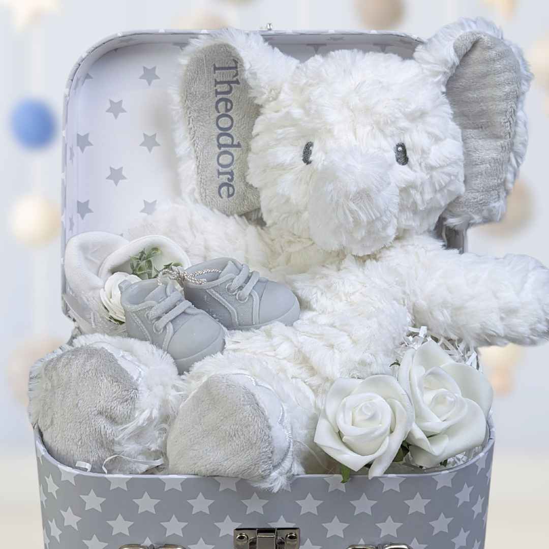 new mum and baby keepsake hamper with elephant soft toy, baby scratch mittens and baby booties candles for mum.