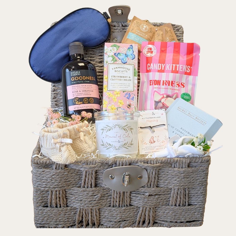 New mum gifts basket with pampering treats and skincare.