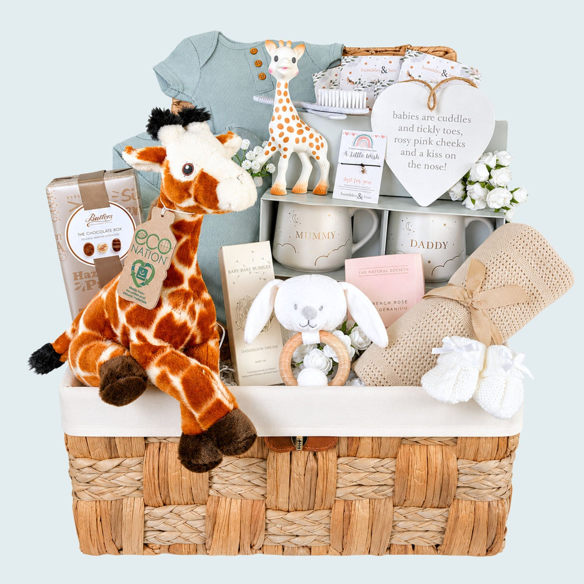 New mum hamper with giraffe theme. Gifts include baby blanket, mum and dad mugs, baby clothing and chocolates. Bumbles and Boo.