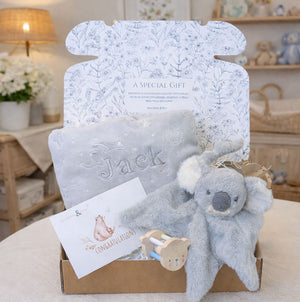 Personalised newborn baby gifts box with grey koala toy and baby blanket.