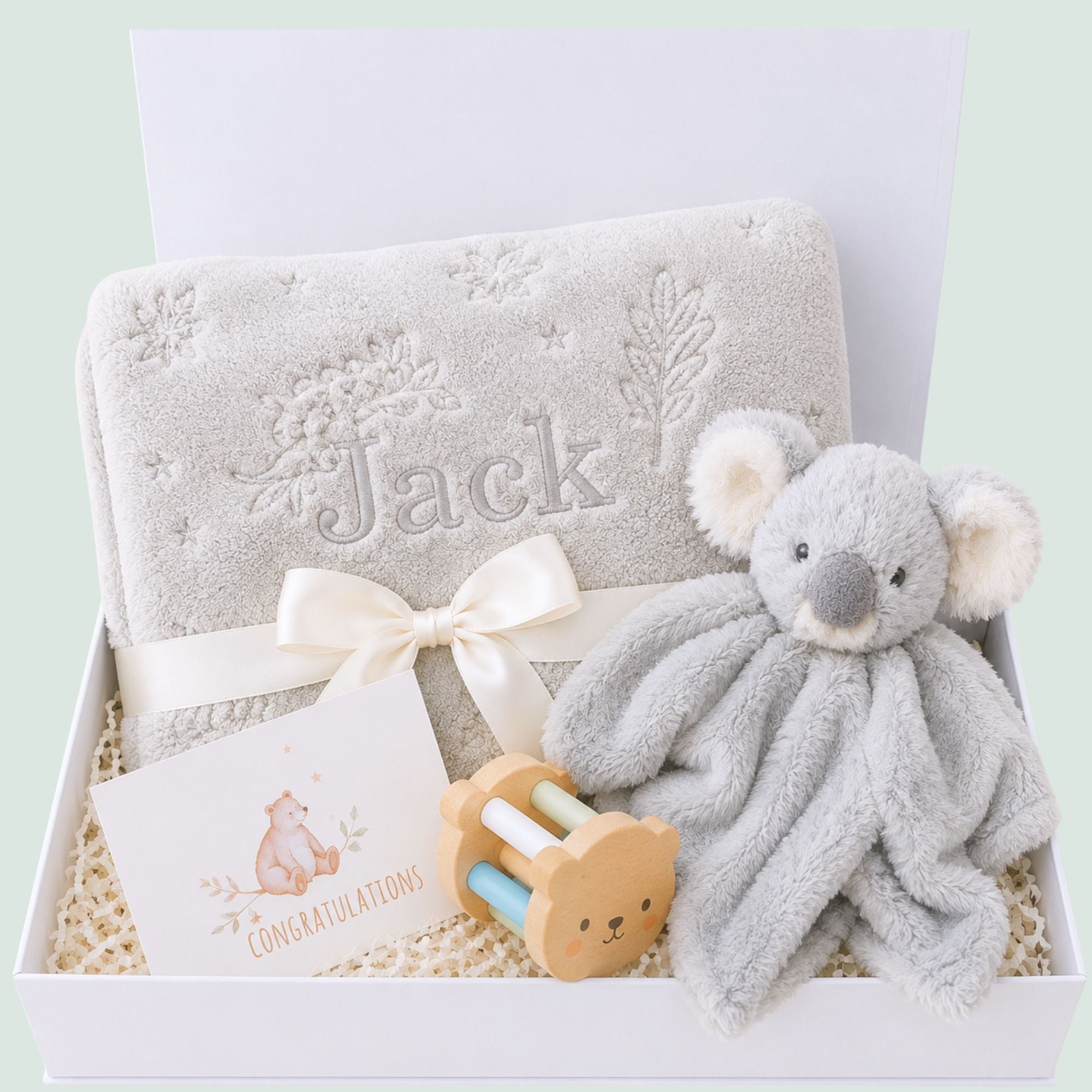 Personalised newborn baby gifts box with grey koala toy and baby blanket.