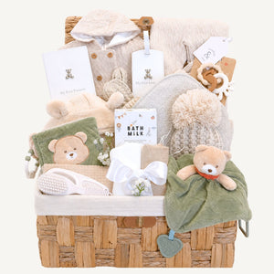 Newborn baby hamper basket packed with sage green gifts in a teddy bears theme, this large gift includes cream, beige and green presents for a new baby.