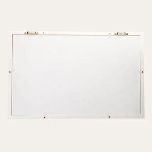 White baby keepsake frame hanging on nursery wall