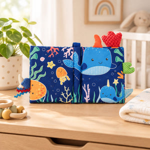 Soft ocean baby book showing colourful sea-themed cloth pages