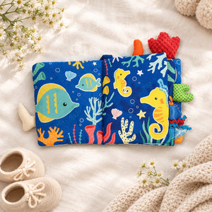 Ocean Fun cloth baby book open to colourful sensory pages