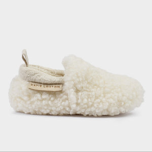 Side view of an off white Borg Baby Shoe with Katie Loxton label