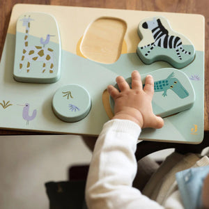 Wooden toy jigsaw puzzle with jungle theme.