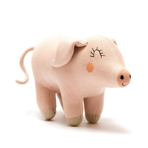 Soft pink knitted pig baby toy made from organic cotton with recycled polyester filling