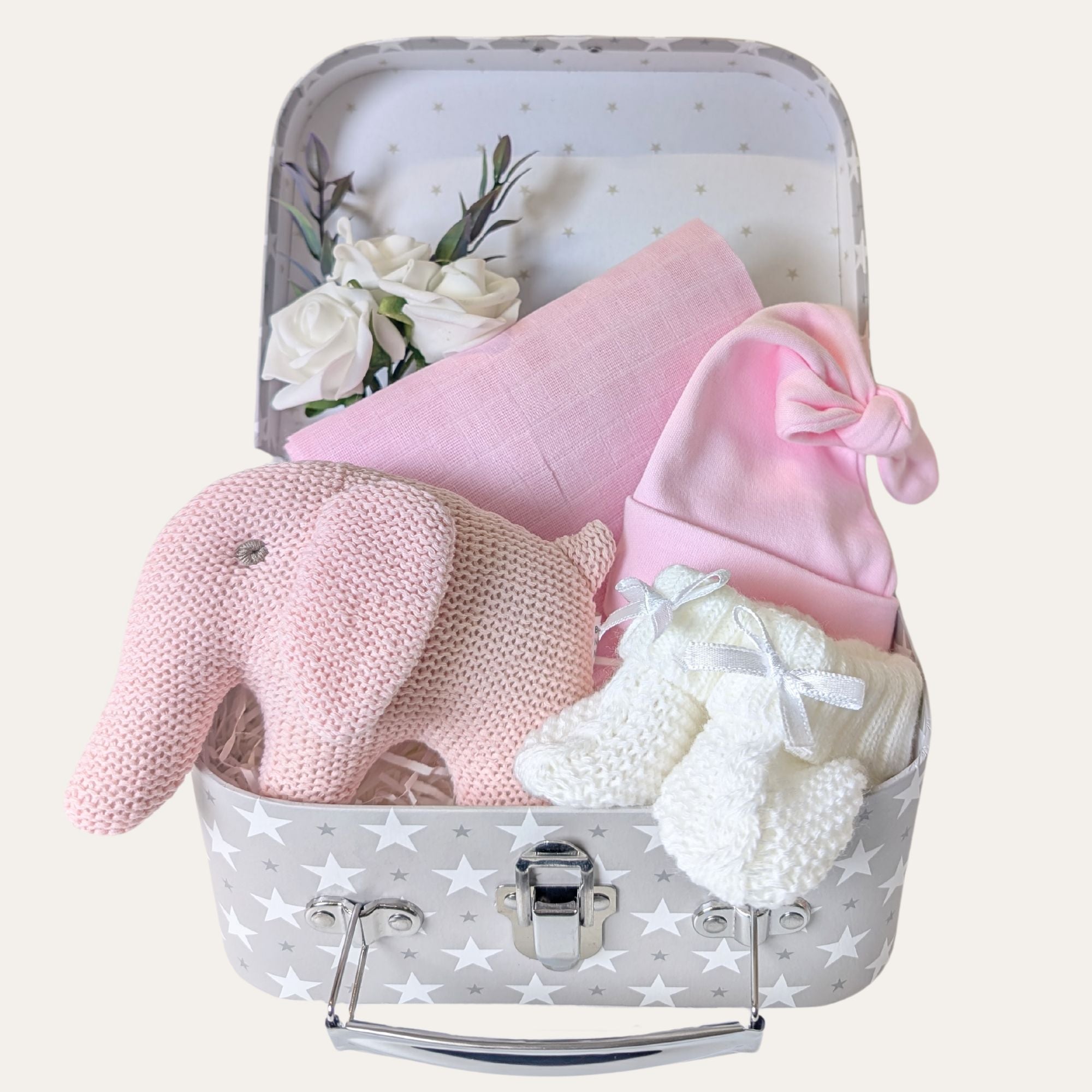 Baby girl hamper with pink gifts including an elephant rattle by Bumbles and Boo.