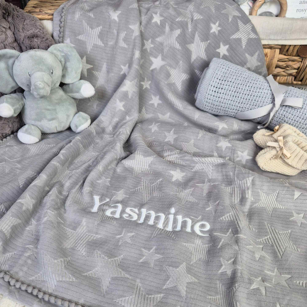 Personalised grey stars baby blanket with Pom Pom trim.