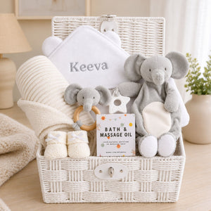 Personalised baby gift hamper basket with elephant comforter soft toy and matching rattle plus bath towel.