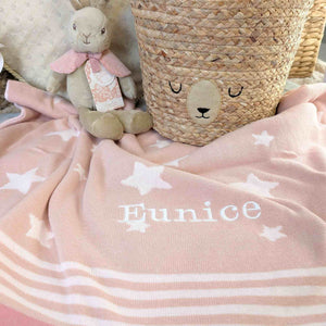 Pale pink personalised baby girl blanket with white stars and stripes.