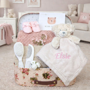 Personalised baby girl hamper gifts in a vintage rose trunk with Elsie embroidered in pink on the comforter