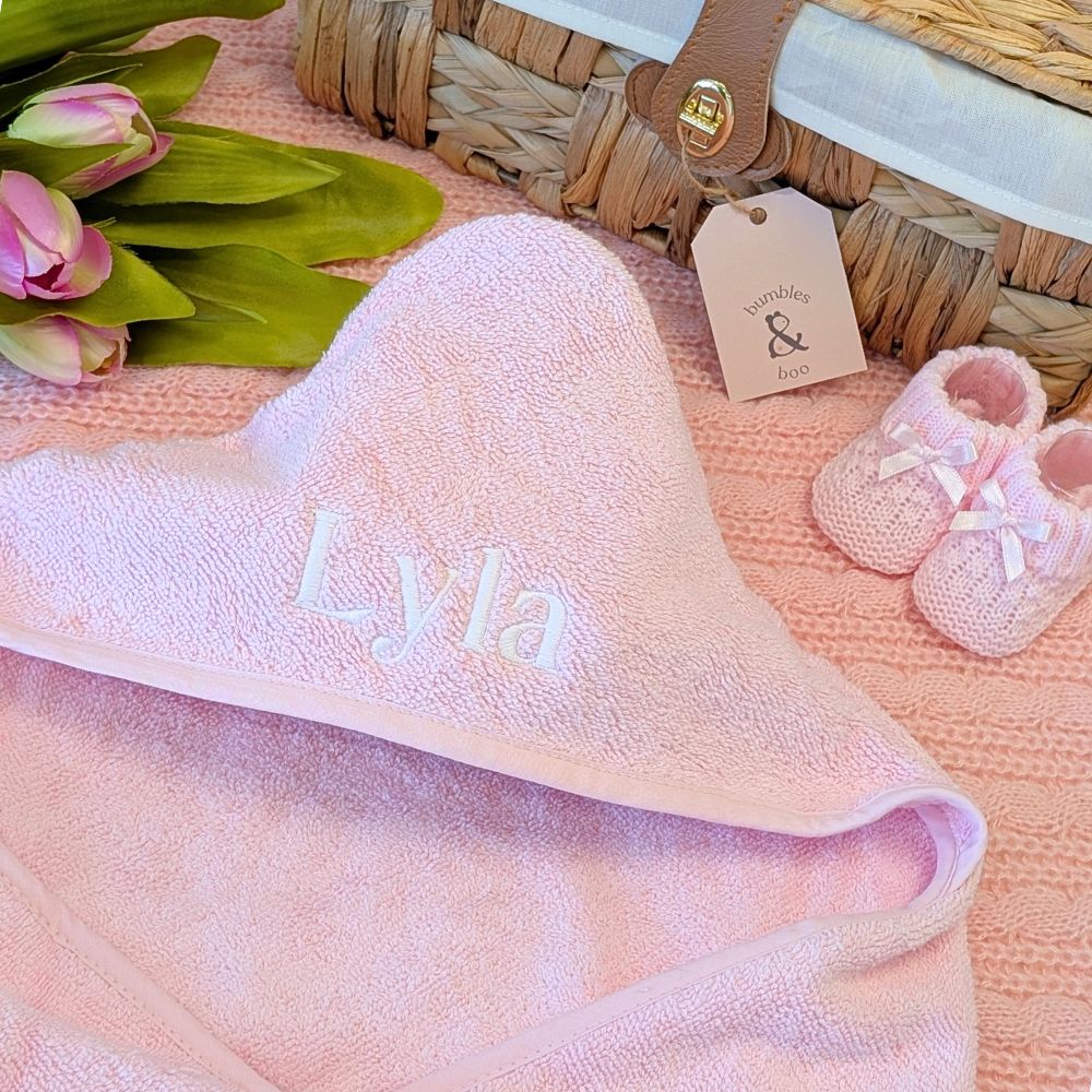 Personalised baby towel in pink with a customised name embroidered on the hood
