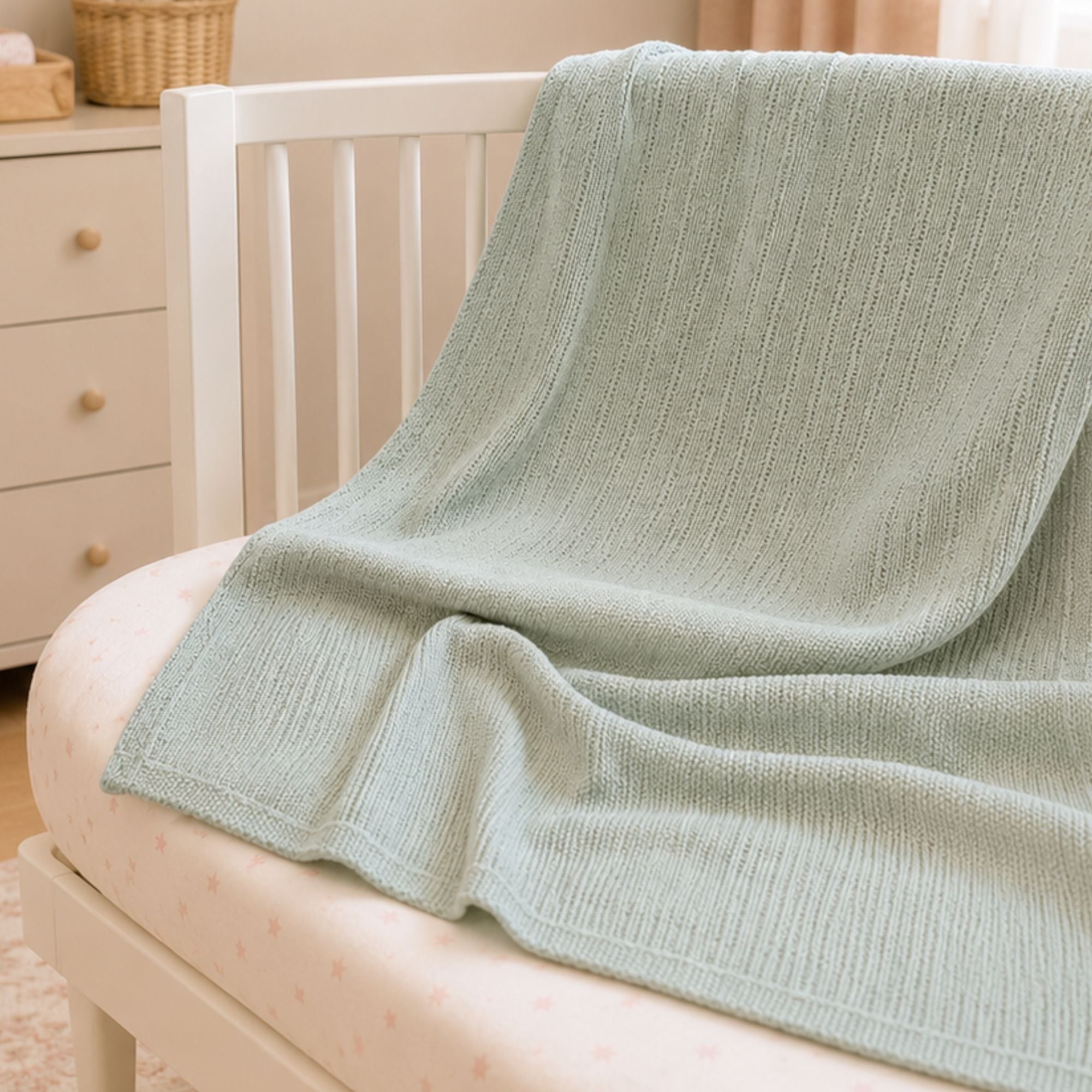 Sage green cotton cellular baby blanket folded, 70 x 90 cm