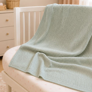 Sage green cotton cellular baby blanket folded, 70 x 90 cm