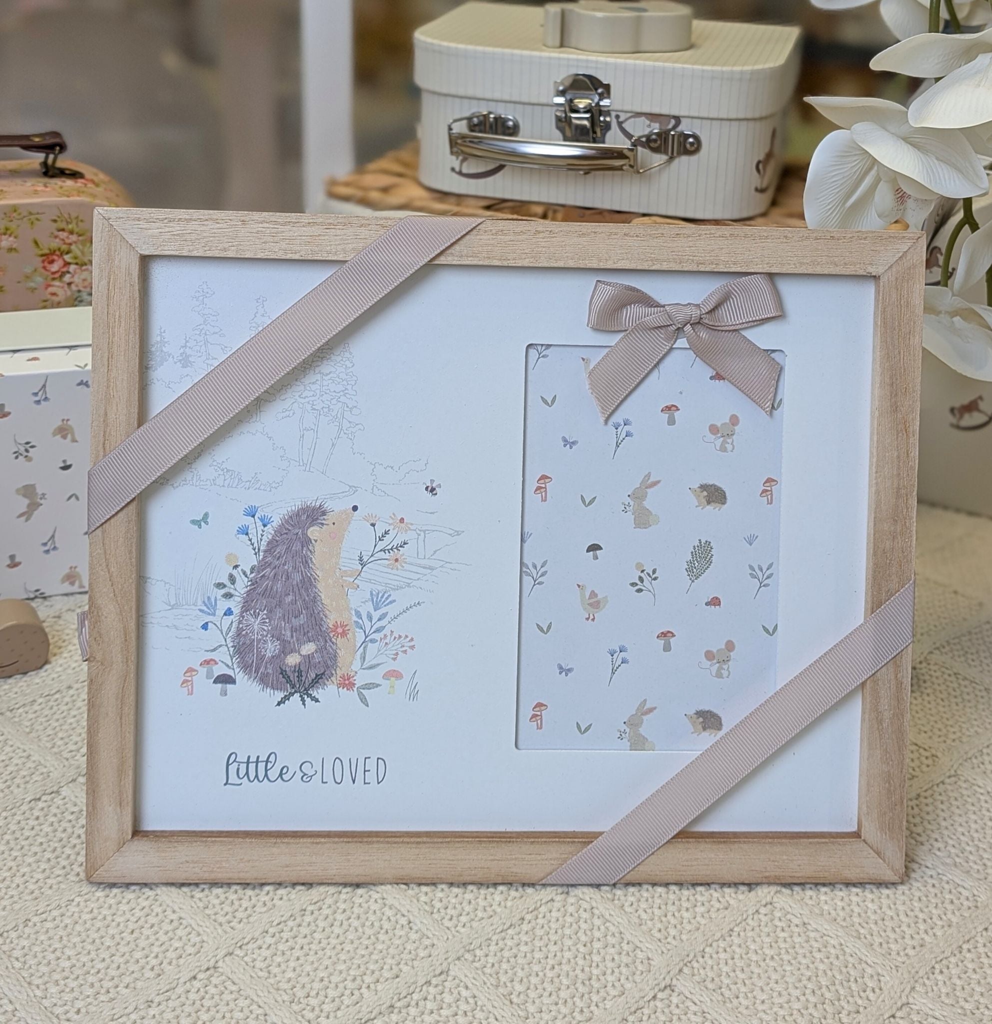 Photo frame for a new baby which reads little and loved.