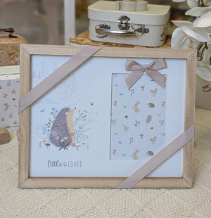 Photo frame for a new baby which reads little and loved.