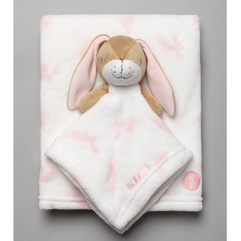 White blanket with pink bunny pattern and a matching bunny comforter.