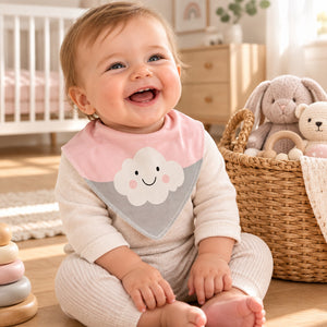 Baby wearing a pink and grey bandana bib with a large smiling white cloud.