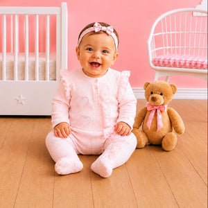 Pink baby girls all-in-one with heart embroidery and appliqué detail