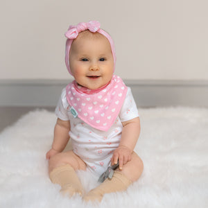 Baby bandana bib with pink heart print, made from soft cotton with absorbent fleece backing
